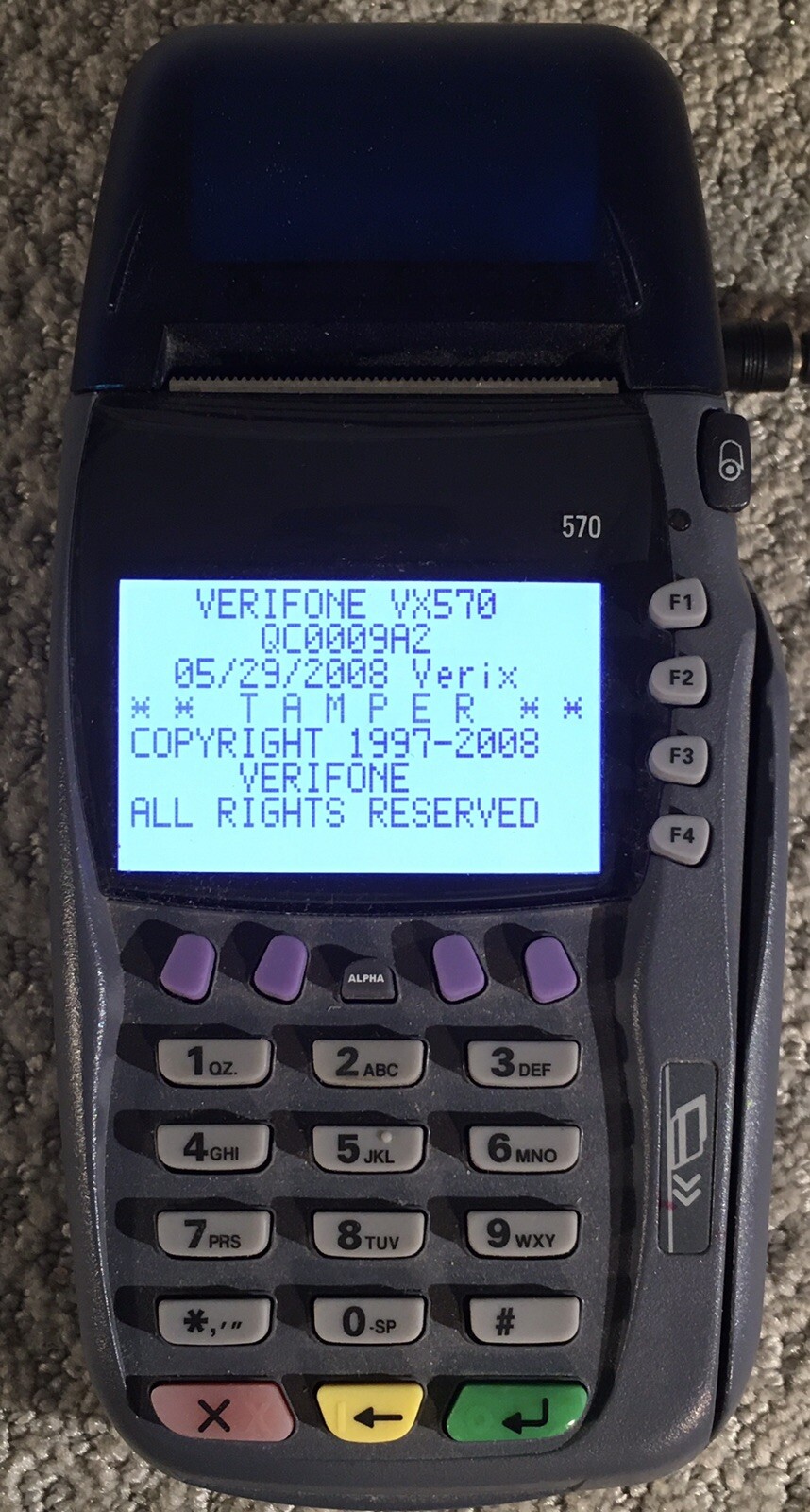 VeriFone VX570 Credit Card Terminal For Repair – Powers On. Rova P/S included.