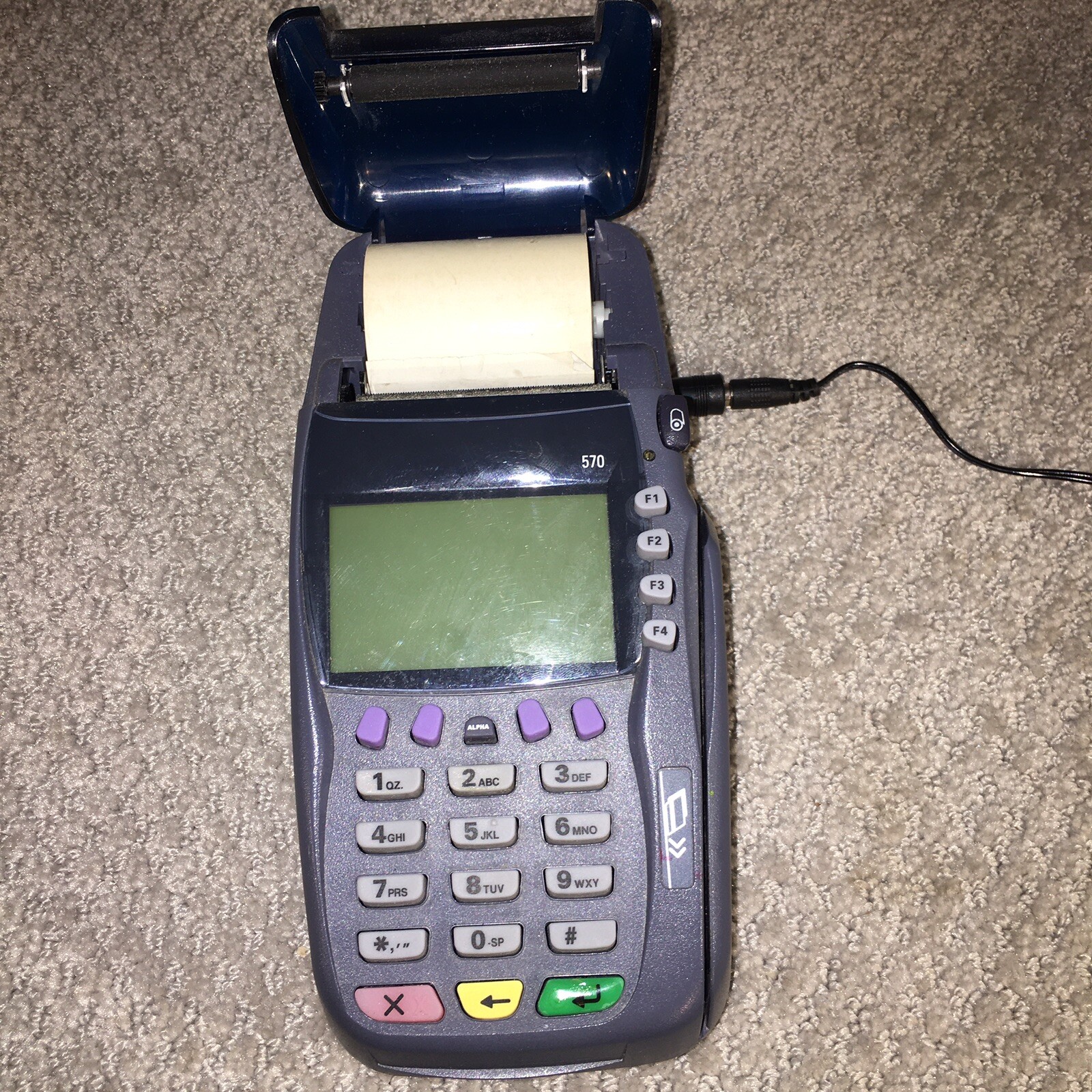 VeriFone VX570 Credit Card Terminal For Repair – Powers On. Rova P/S included.