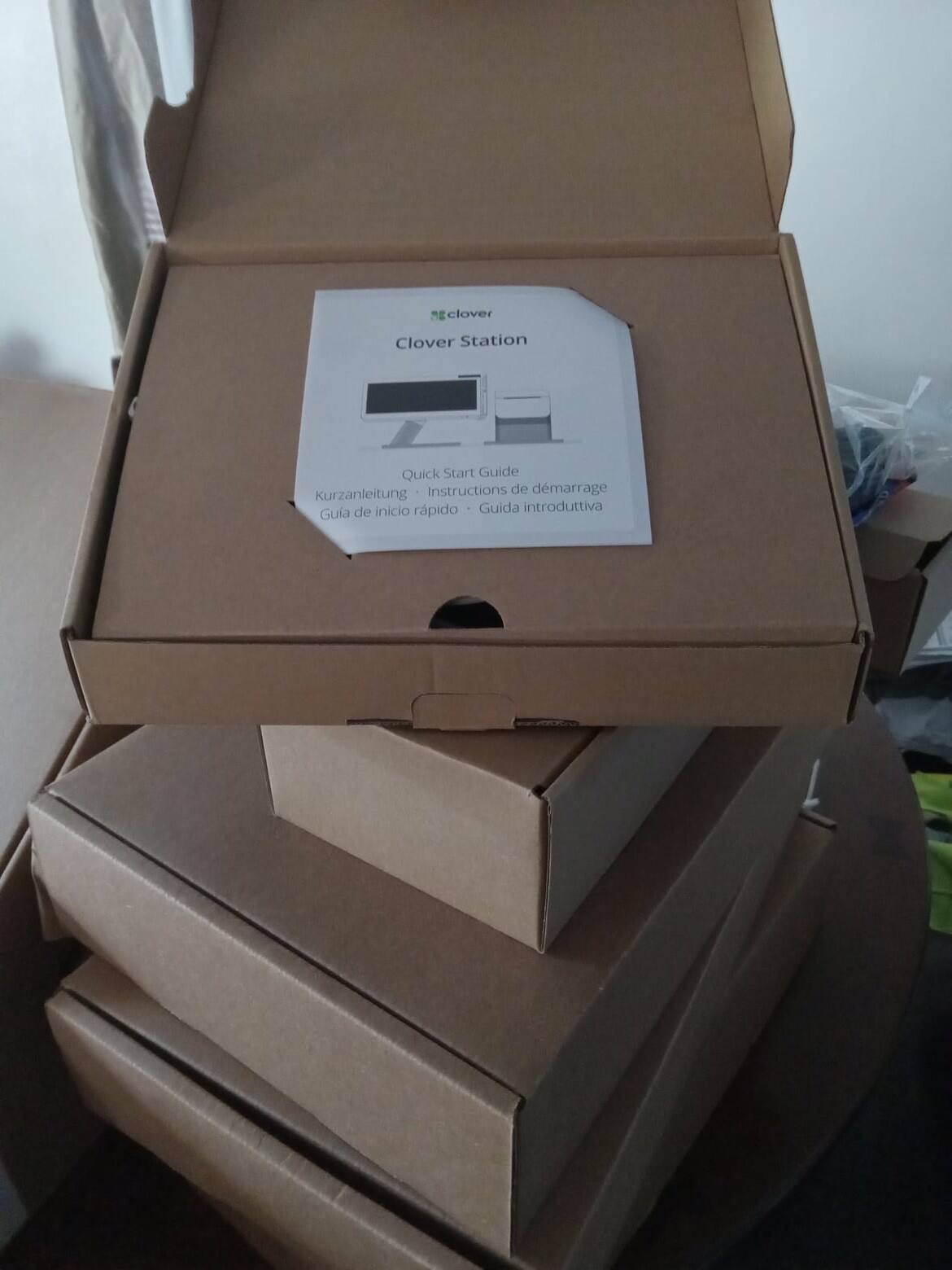 Clover Station C500 POS System with receipt printer and roll of receipt paper